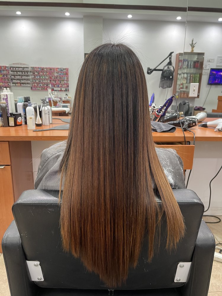Brunette-to-caramel ombré hair color at Tiptop Hair Designs