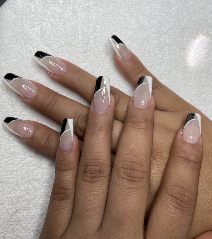 Black and white chrome French tip nail design at Tiptop Hair Designs